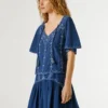 Blouse à col en V avec détails brodés