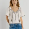 Blouse à col en V brodée